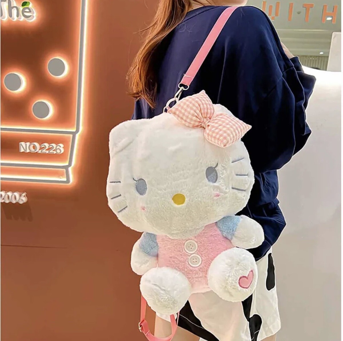 Illustrative example of hello kitty backpack plush