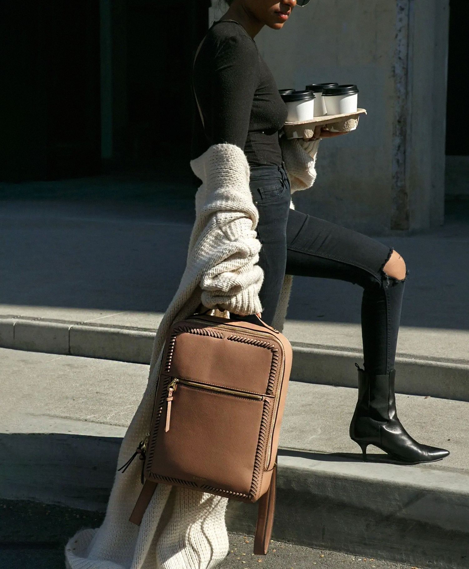 Illustrative example of leather laptop backpack for women